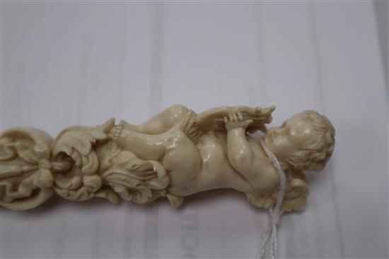 A 19th century Dieppe carved ivory parasol handle length 27.5cm